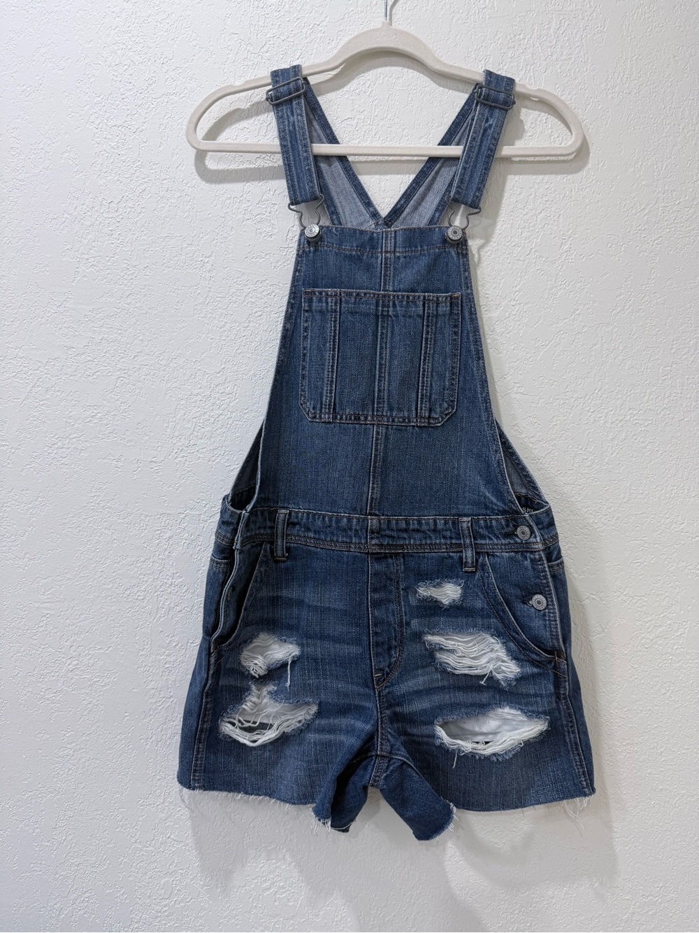 American Eagle Outfitters Distressed Dark Blue Denim Shortall Overalls.